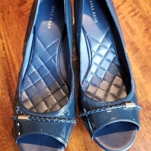 Cole Haan patent leather peep toe shoes.
